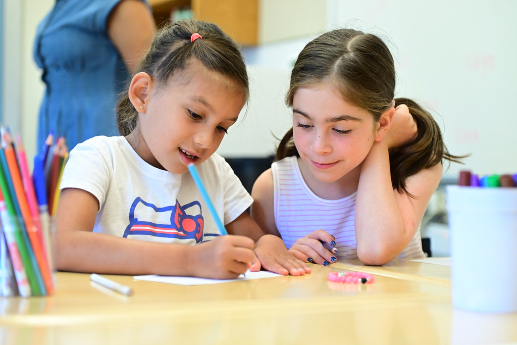 Fieldston Lower students collaborate at their desks.