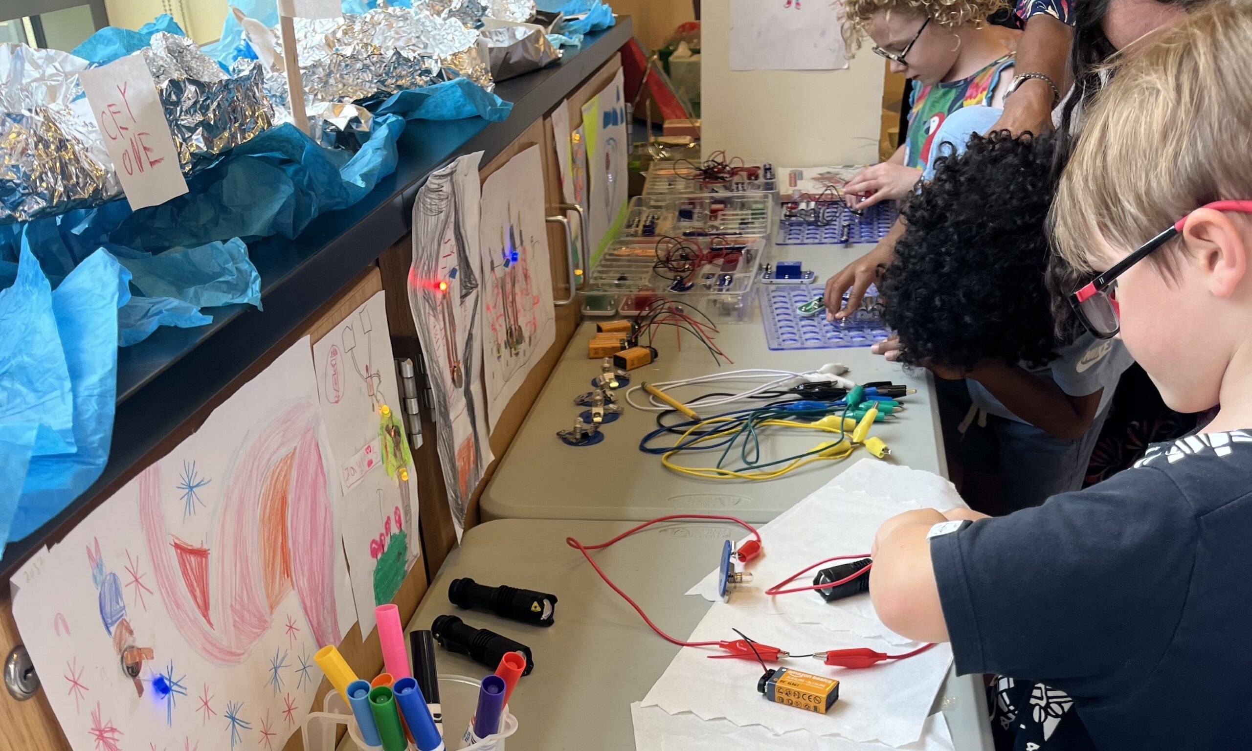 Summer at ECFS campers participate in a STEM activity.