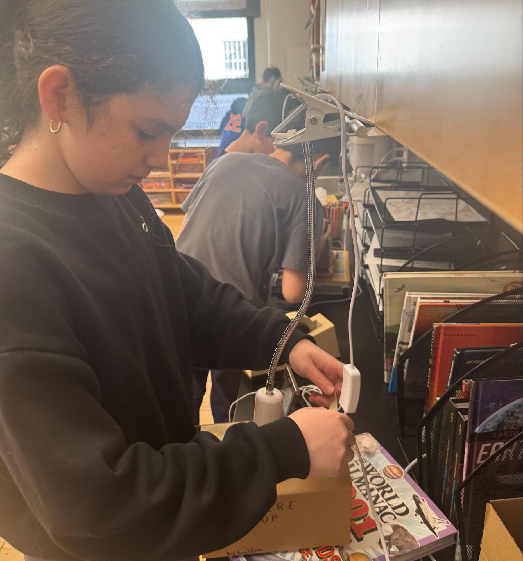Ethical Culture 5th Grader doing science experiment