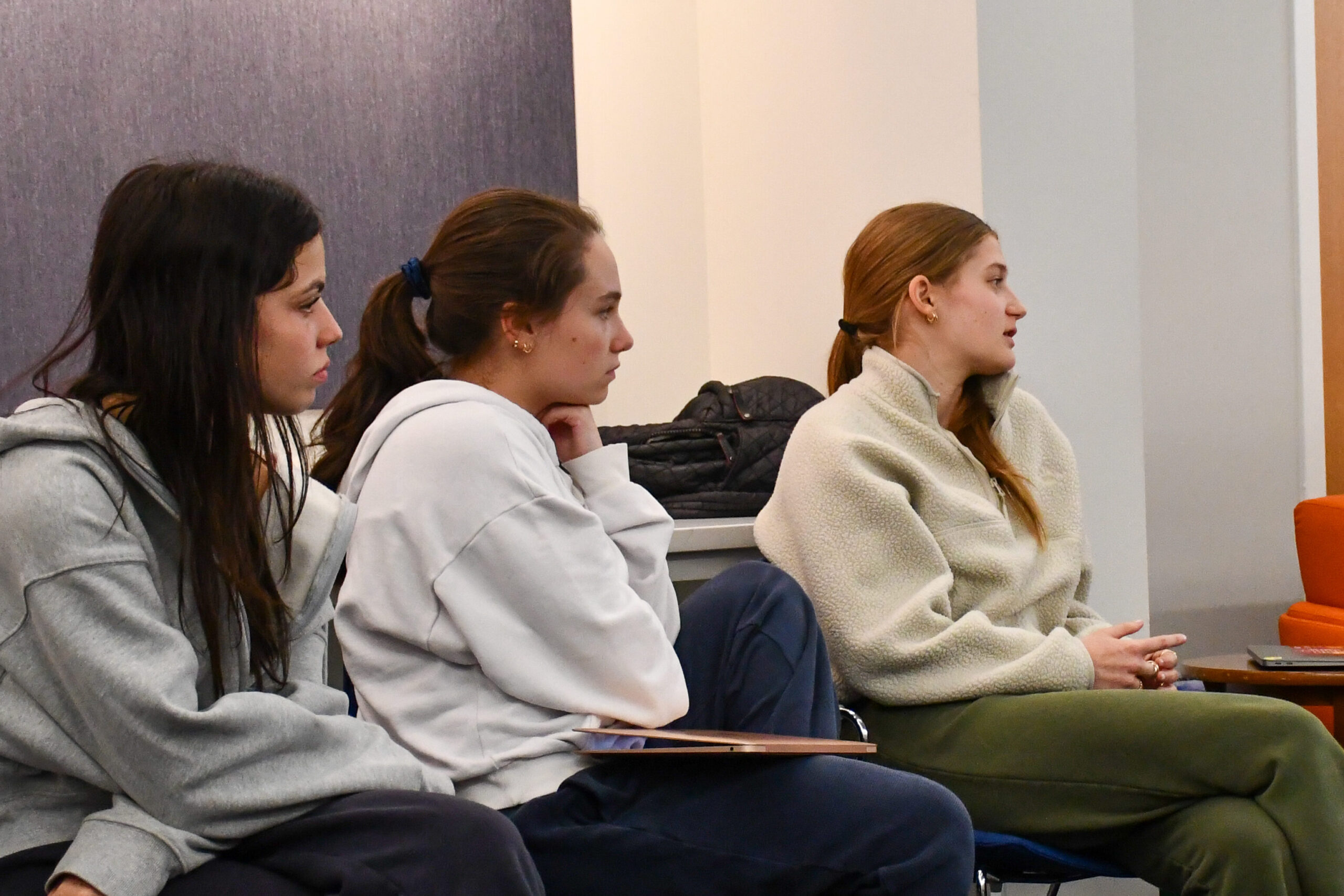 Fieldston Upper PLOP students meet for a training session in a conference room on campus.