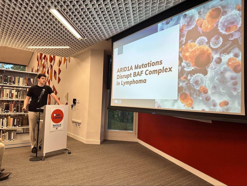 An Ethical Culture Fieldston School student speaks at science research event.