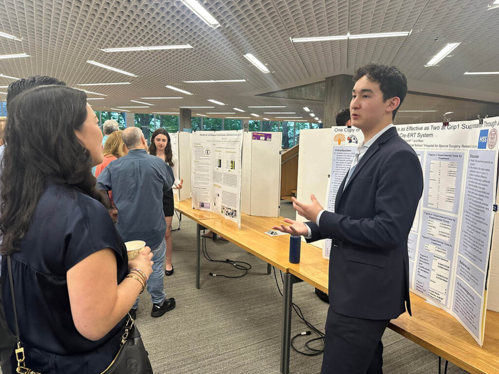An Ethical Culture Fieldston School student speaks at science research event.