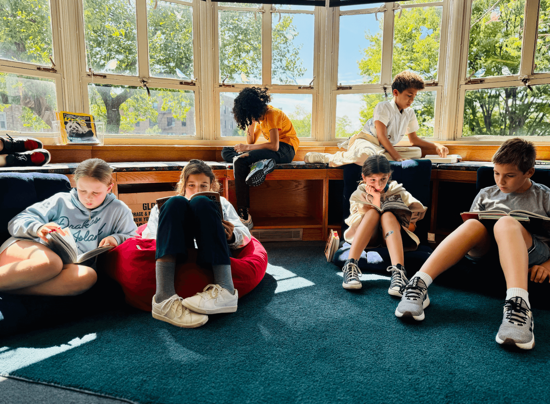 Ethical Culture Fieldston School 5th Graders read in the library.