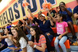 Community cheers on team from bleachers