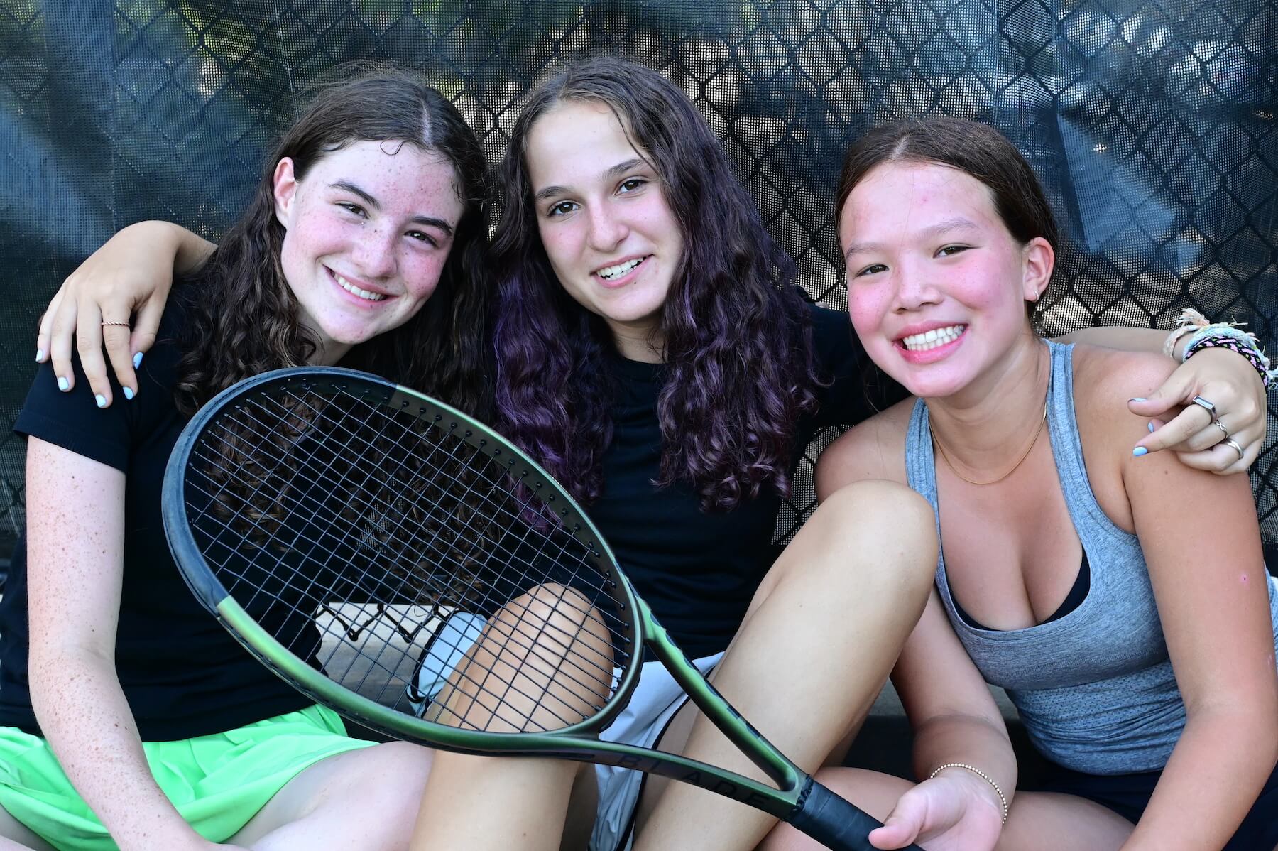 Ethical Culture Fieldston School Fieldston Upper girls tennis team smiling for a photo