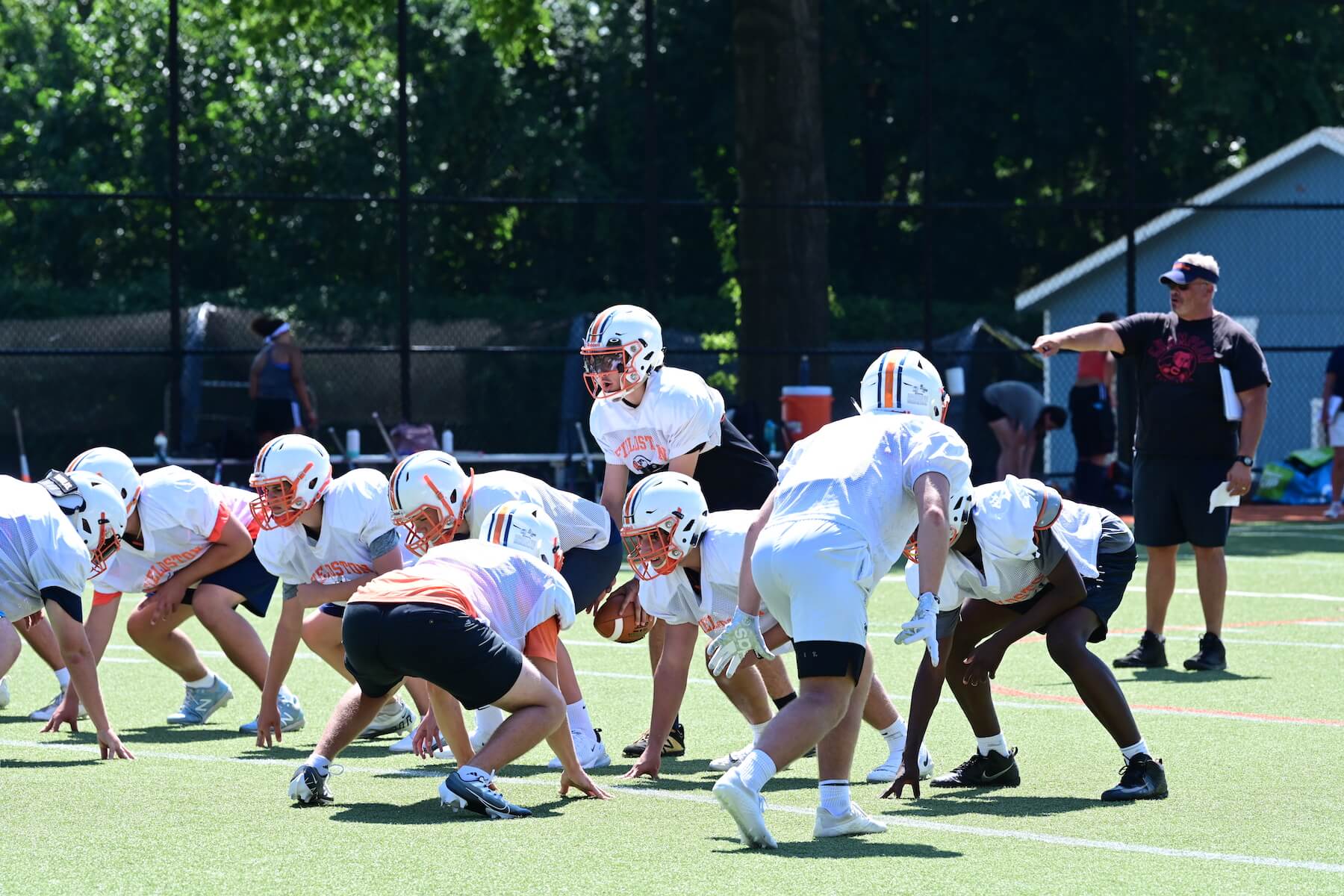 Ethical Culture Fieldston School Fieldston Upper football team practices on the field