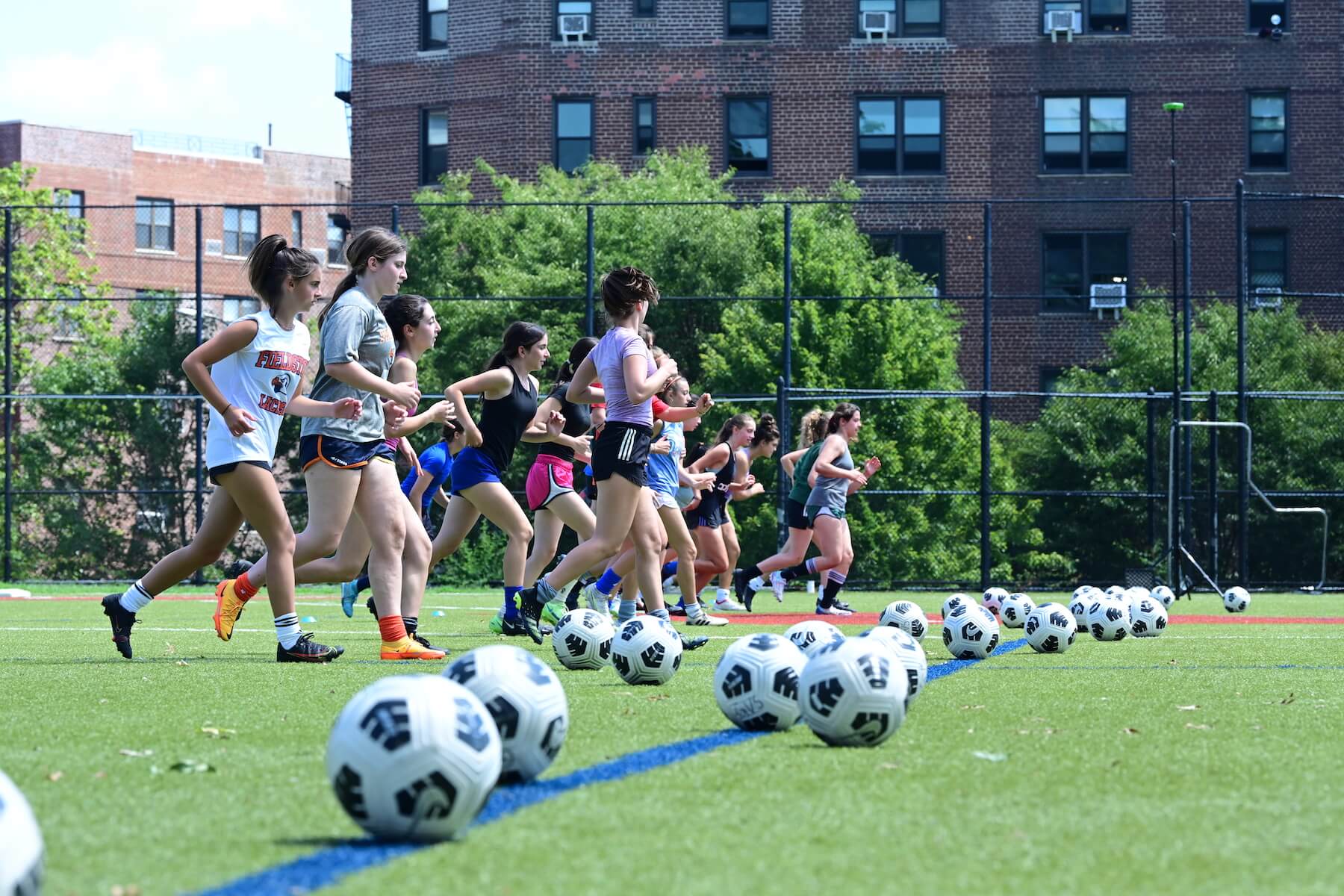 Ethical Culture Fieldston School Fieldston Upper girls soccer team practices on the field