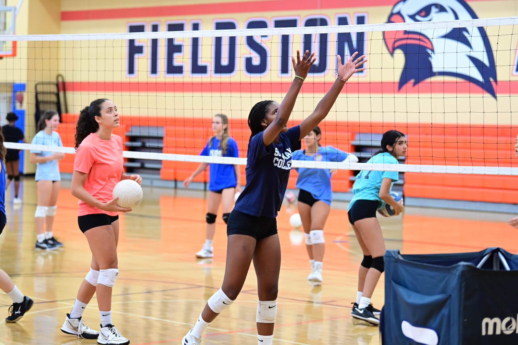 Ethical Culture Fieldston School Fieldston Upper volleyball team practices in the gym
