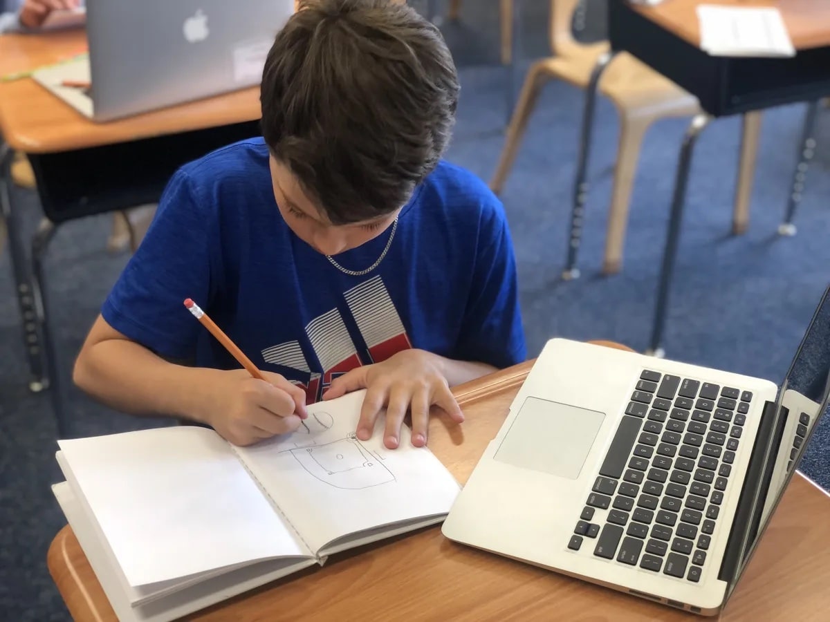 An Ethical Culture Fieldston School 5th Grader researches on a laptop