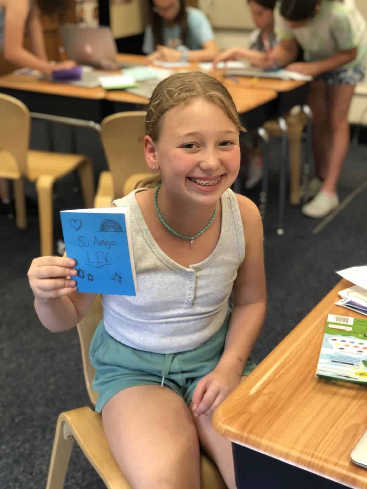 An Ethical Culture Fieldston School 5th Grader shows off a book they made