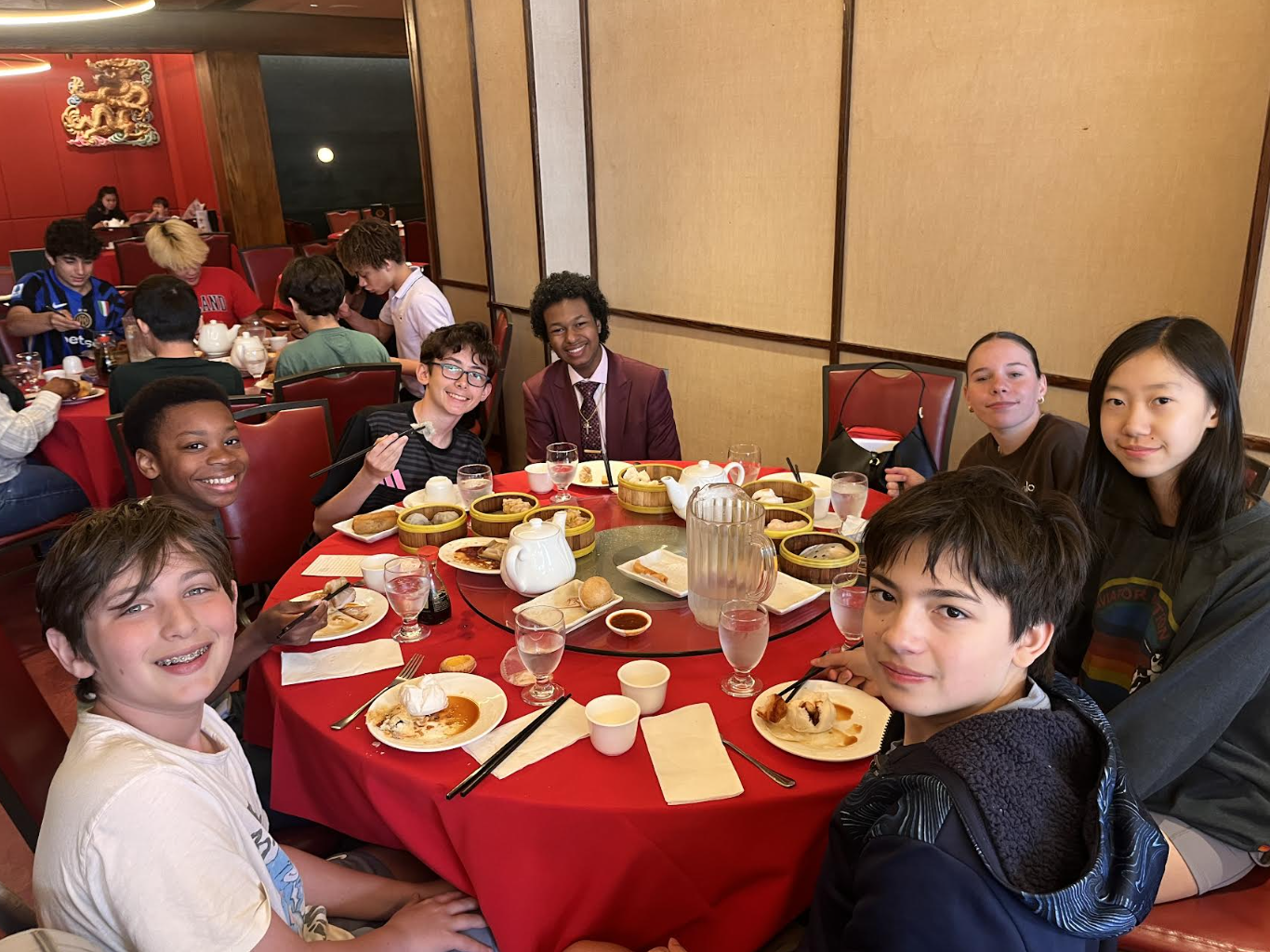 A group of ECFS students enjoy dim sum during an experiential learning trip to Chinatown