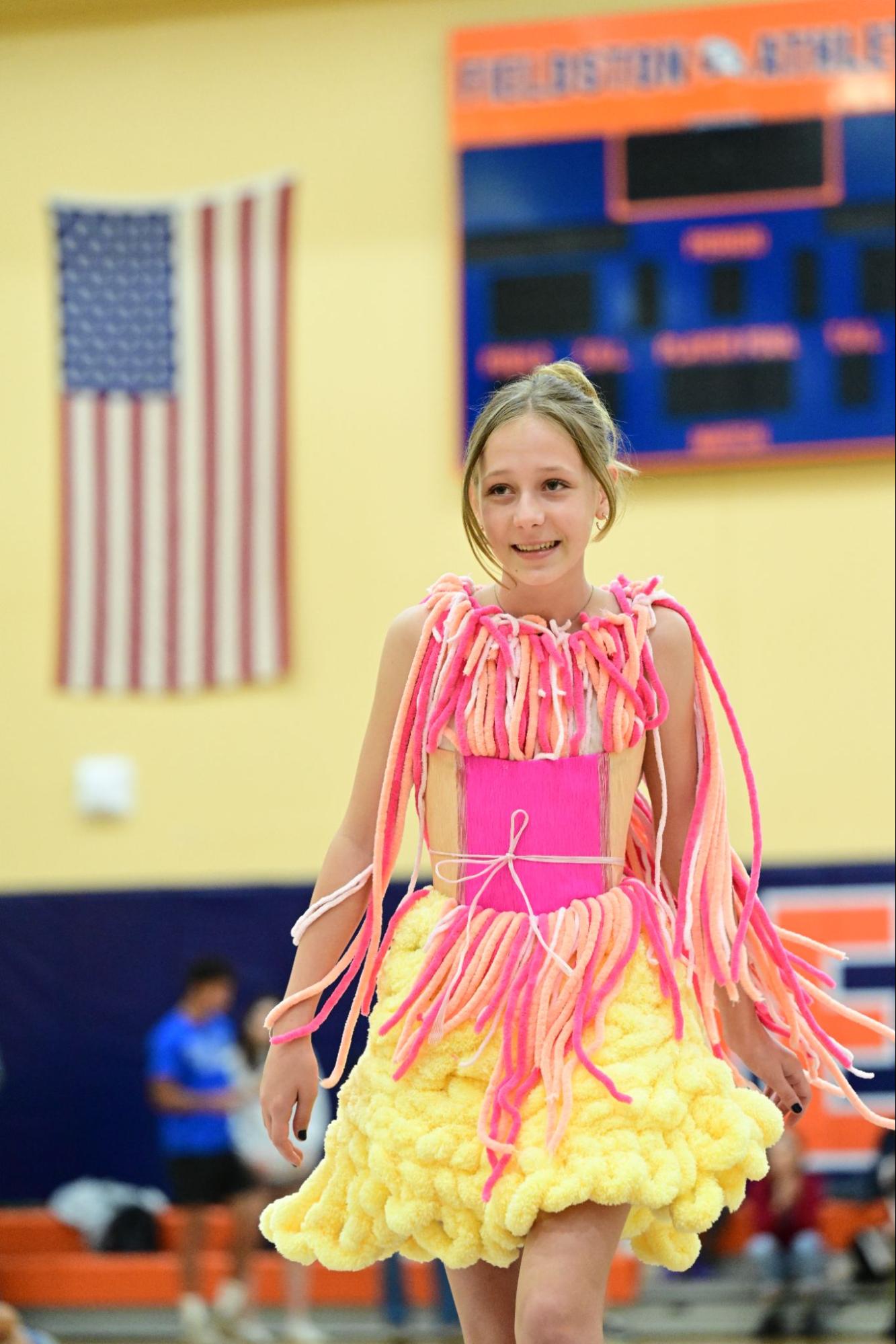 An ECFS Middle School student strikes a pose during the Fashion Show