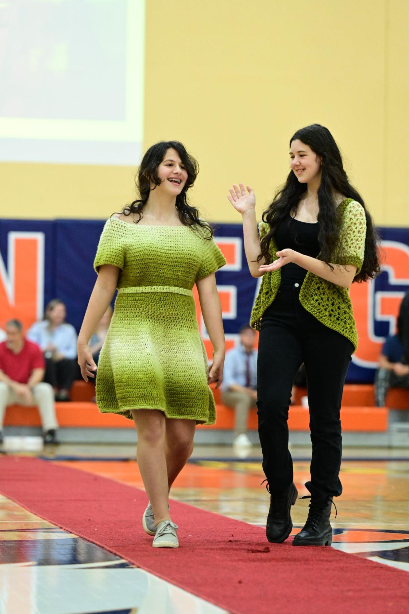 Two ECFS Middle School students pose during the Fashion Show