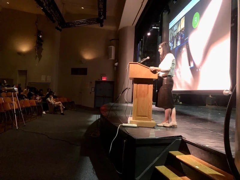 Speaker at podium in auditorium