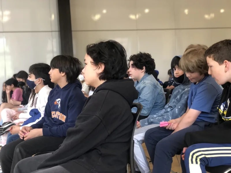 Close up image of students listening to guest speaker in Student Commons