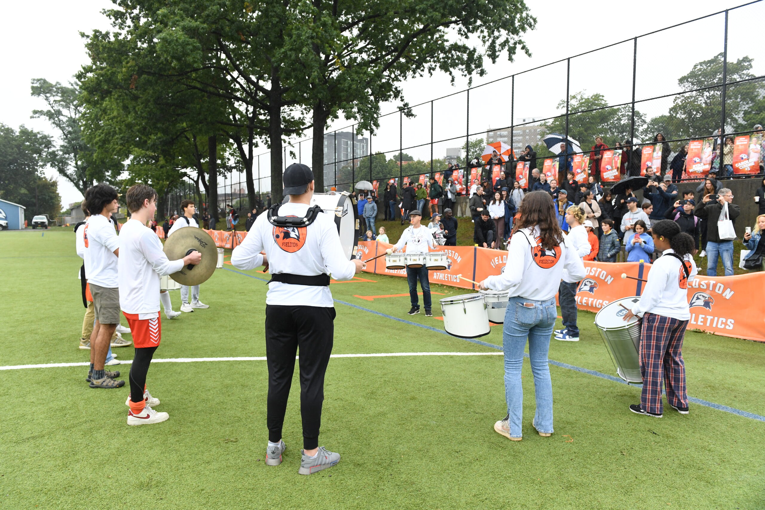 The Fieldston percussion ensemble performs in front of community members