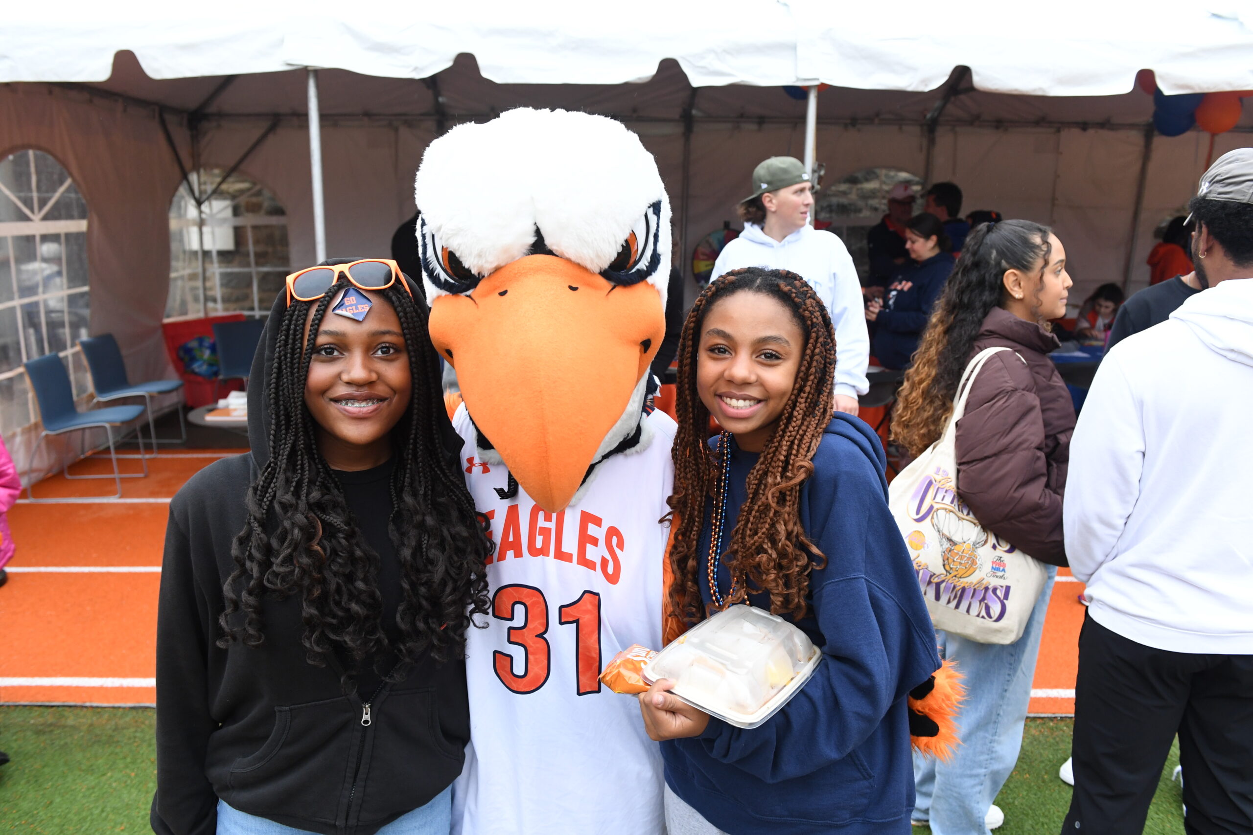 Two students pose with the ECFS Eagle