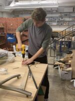 Ethical Culture Fieldston School Upper School student constructs a Rube Goldberg machine