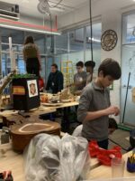 Ethical Culture Fieldston School Upper School students construct a Rube Goldberg machine