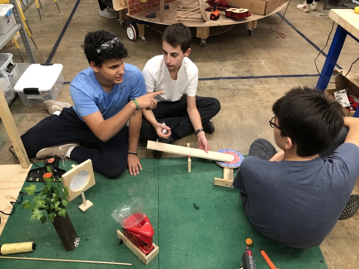 Ethical Culture Fieldston School Upper School students construct a Rube Goldberg machine