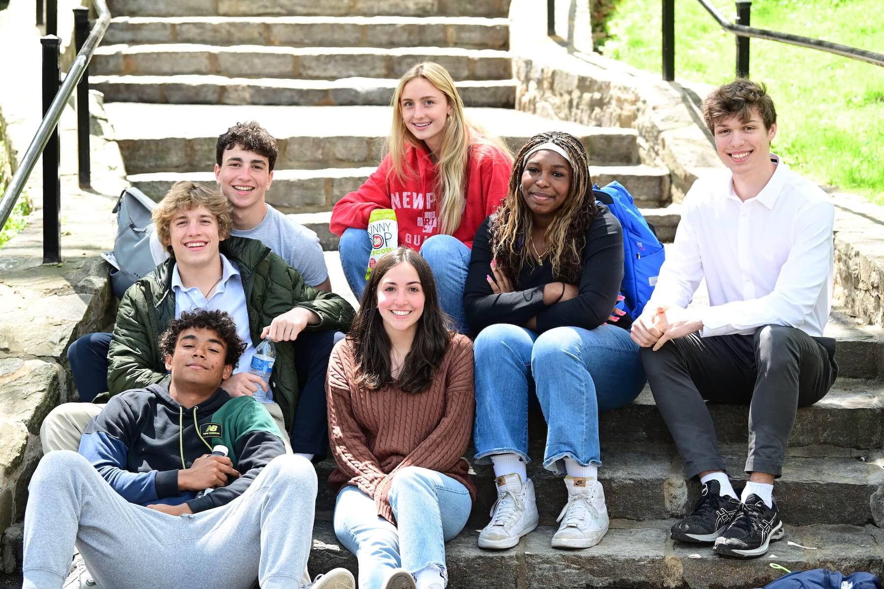 Ethical Culture Fieldston School Fieldston Upper students sit on the stairs in the quad during the College Symposium