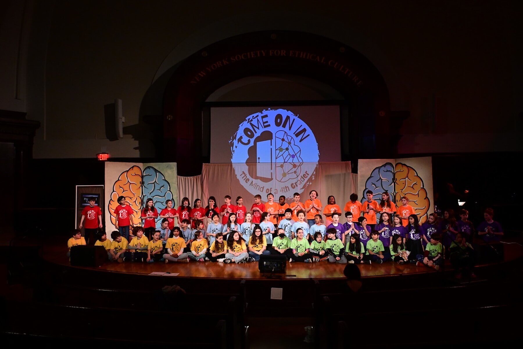 Ethical Culture 4th Graders pose on stage during the annual 4th Grade play. 