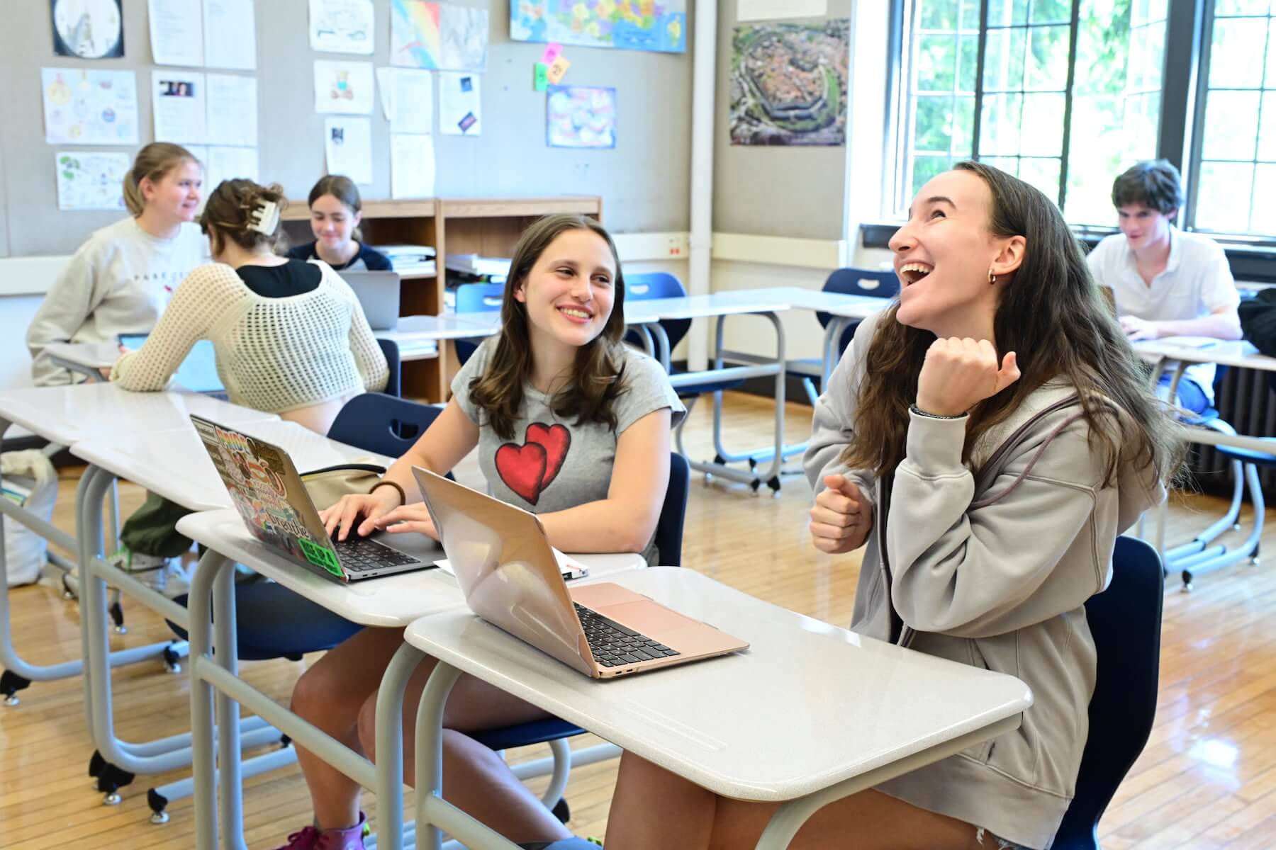 Ethical Culture Fieldston School Upper School students laughing together in class