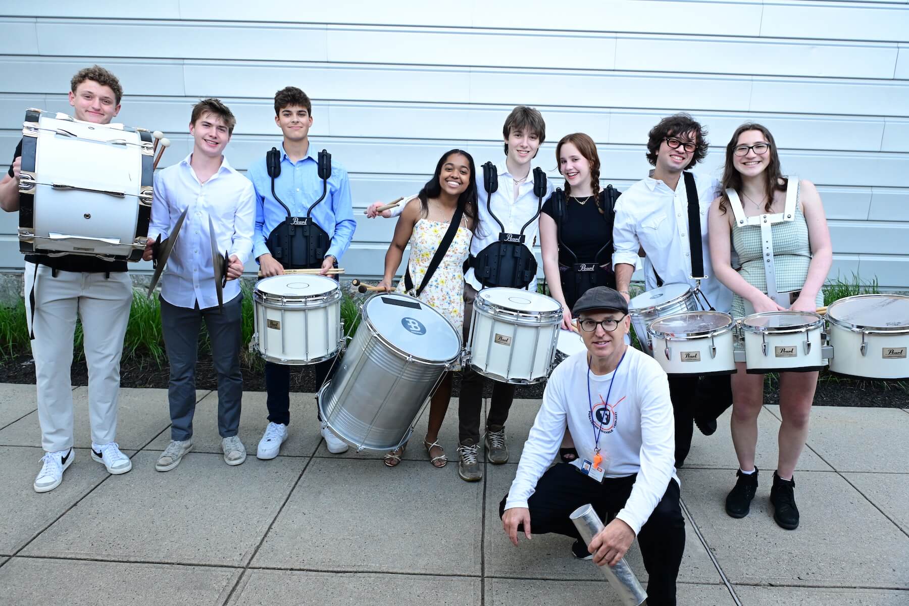 Ethical Culture Fieldston School Upper School students smiling while holding their percussion instruments