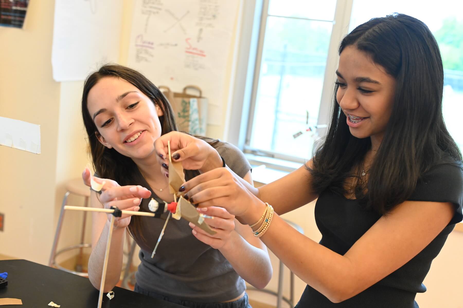 Ethical Culture Fieldston School Middle School students work together to build a wind powered experiment
