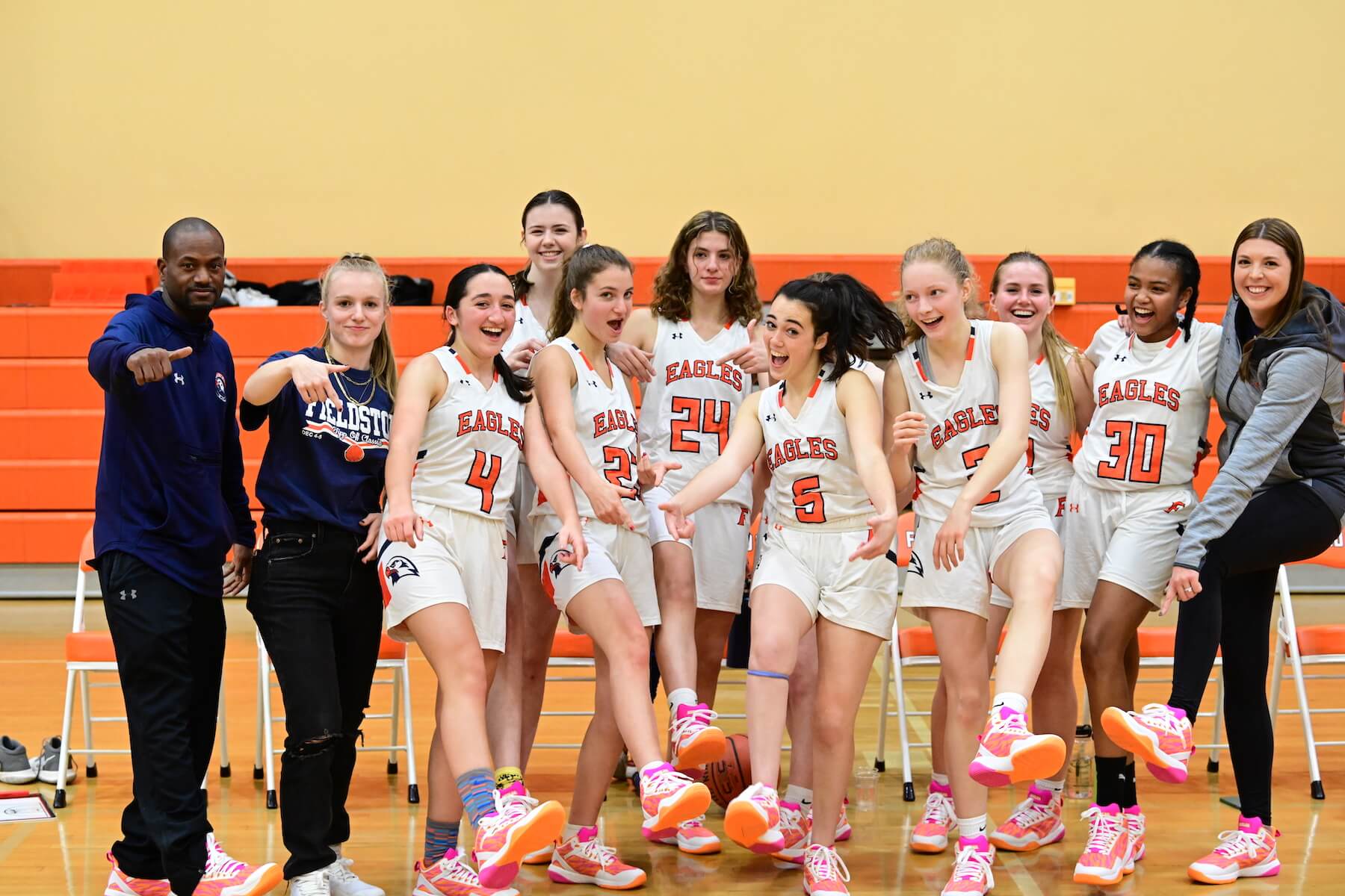 Ethical Culture Fieldston School Basket Ball Team gathers for a photo on the court