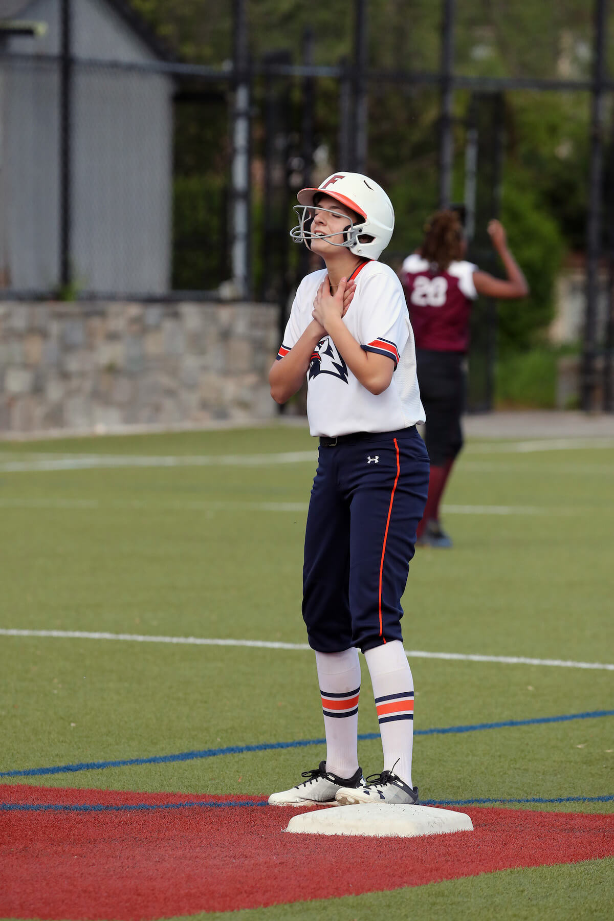 Ethical Culture Fieldston School Baseball Team member exhales in relief for arriving safely on base