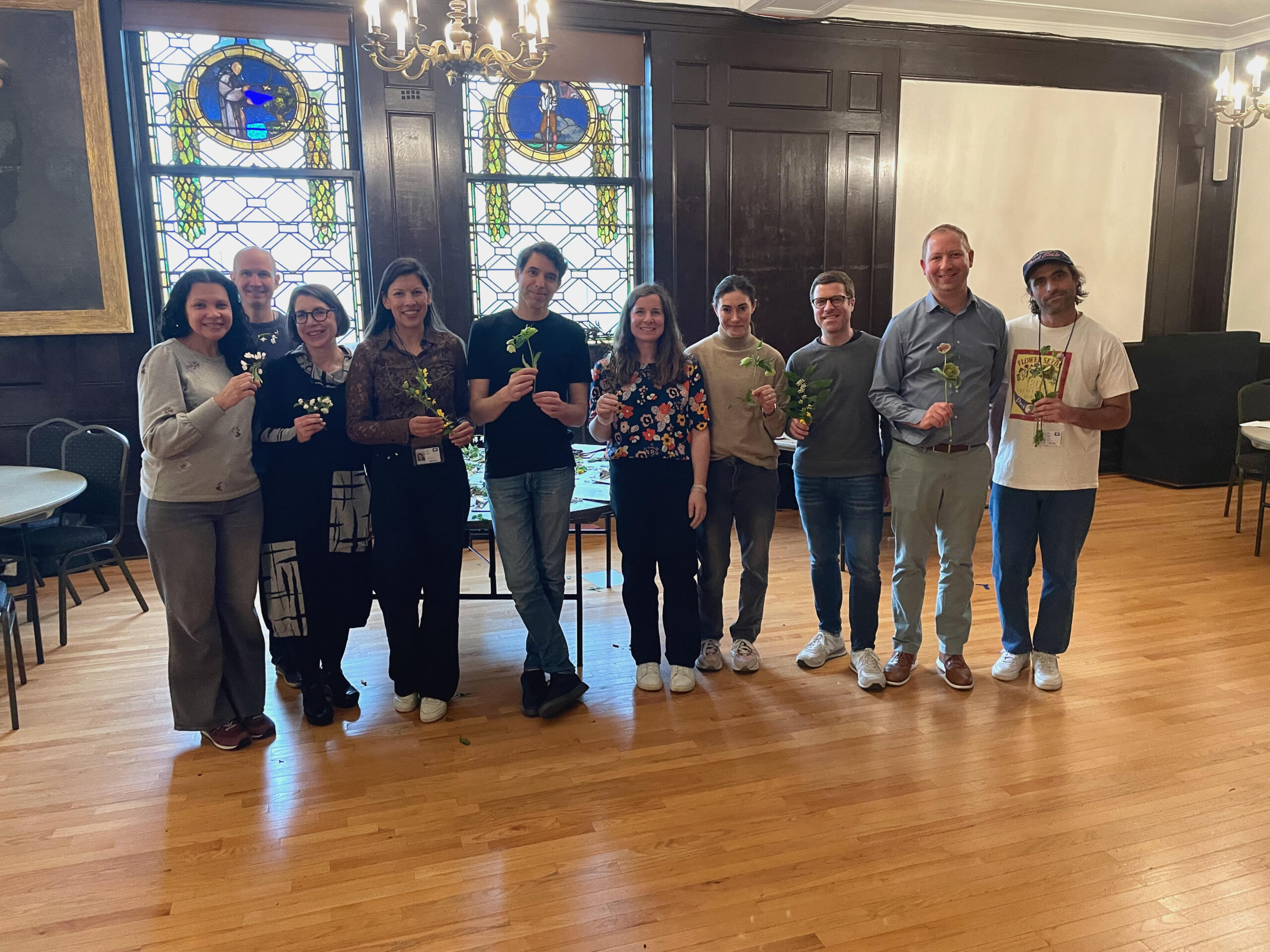 Event volunteers pose in Ceremonial Hall. 