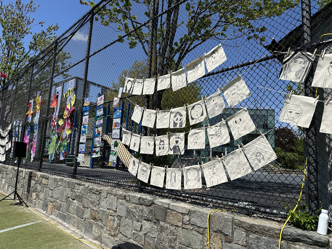 ethical culture fieldston school fieldston lower art showcased on the fence at Spring Festival