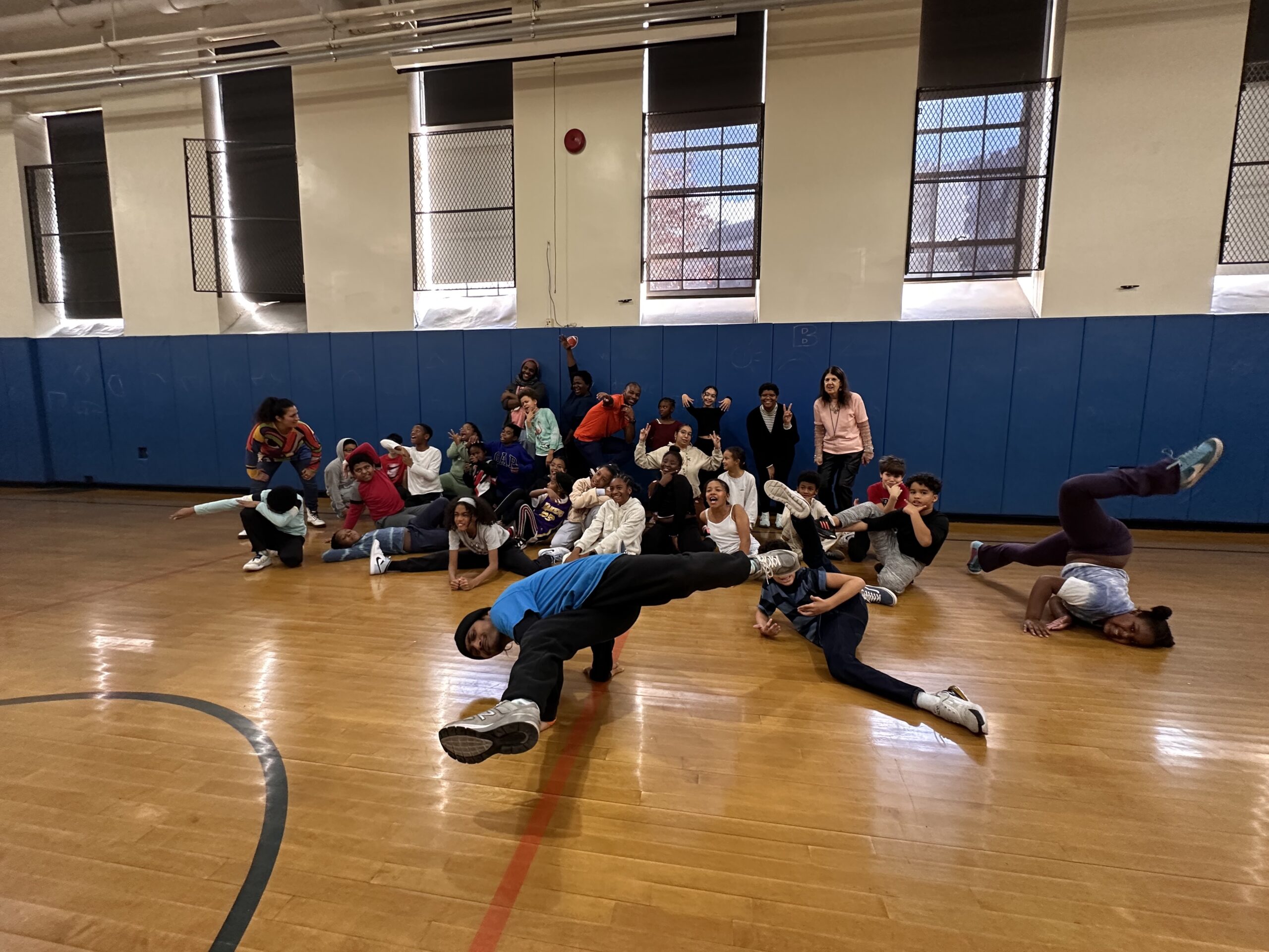 The ECFS Black and Latine CARe groups pose together after breakdancing class.