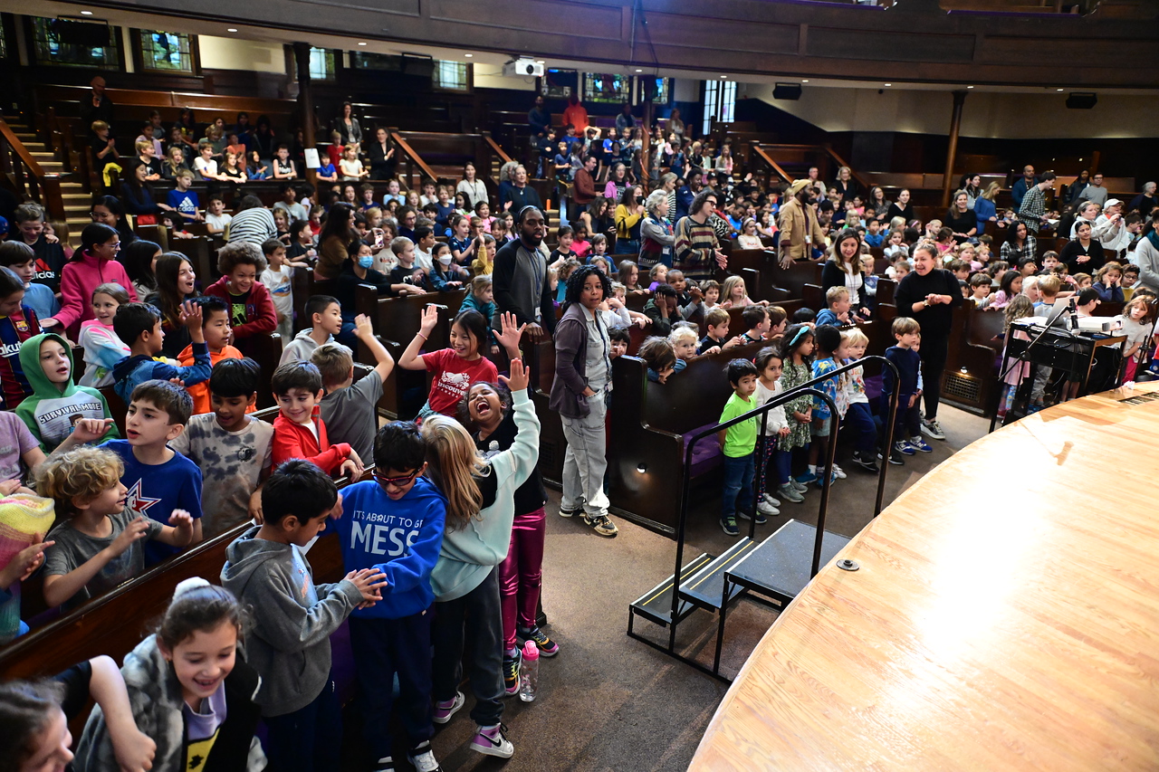 Ethical Culture students enjoy assembly as they sit in the audience.