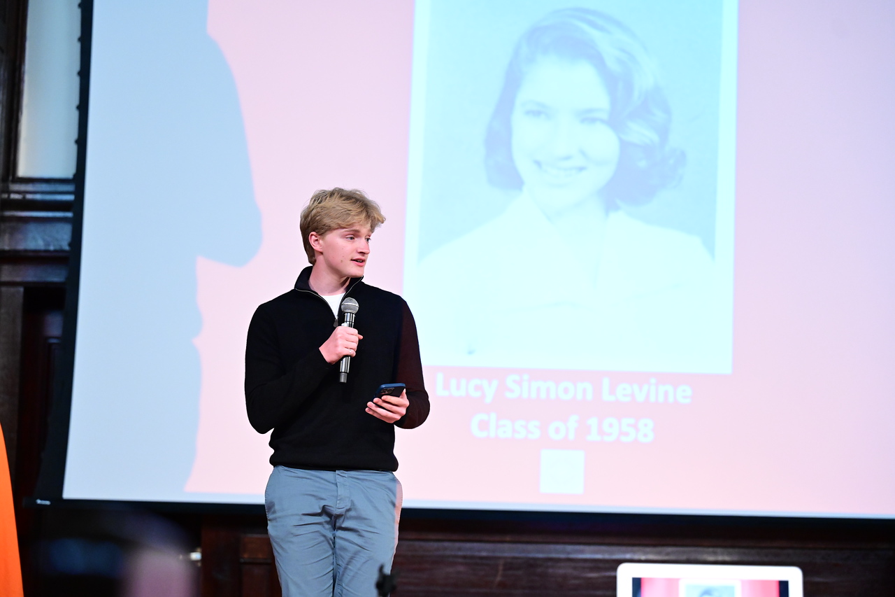 Lucy Simon Levine's grandson Charlie gives a speech on stage in her honor.