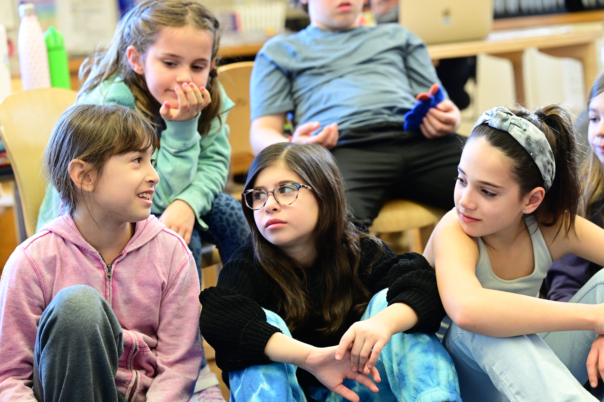 Students discuss rumors and gossip while sitting in a circle at Ethical Culture.