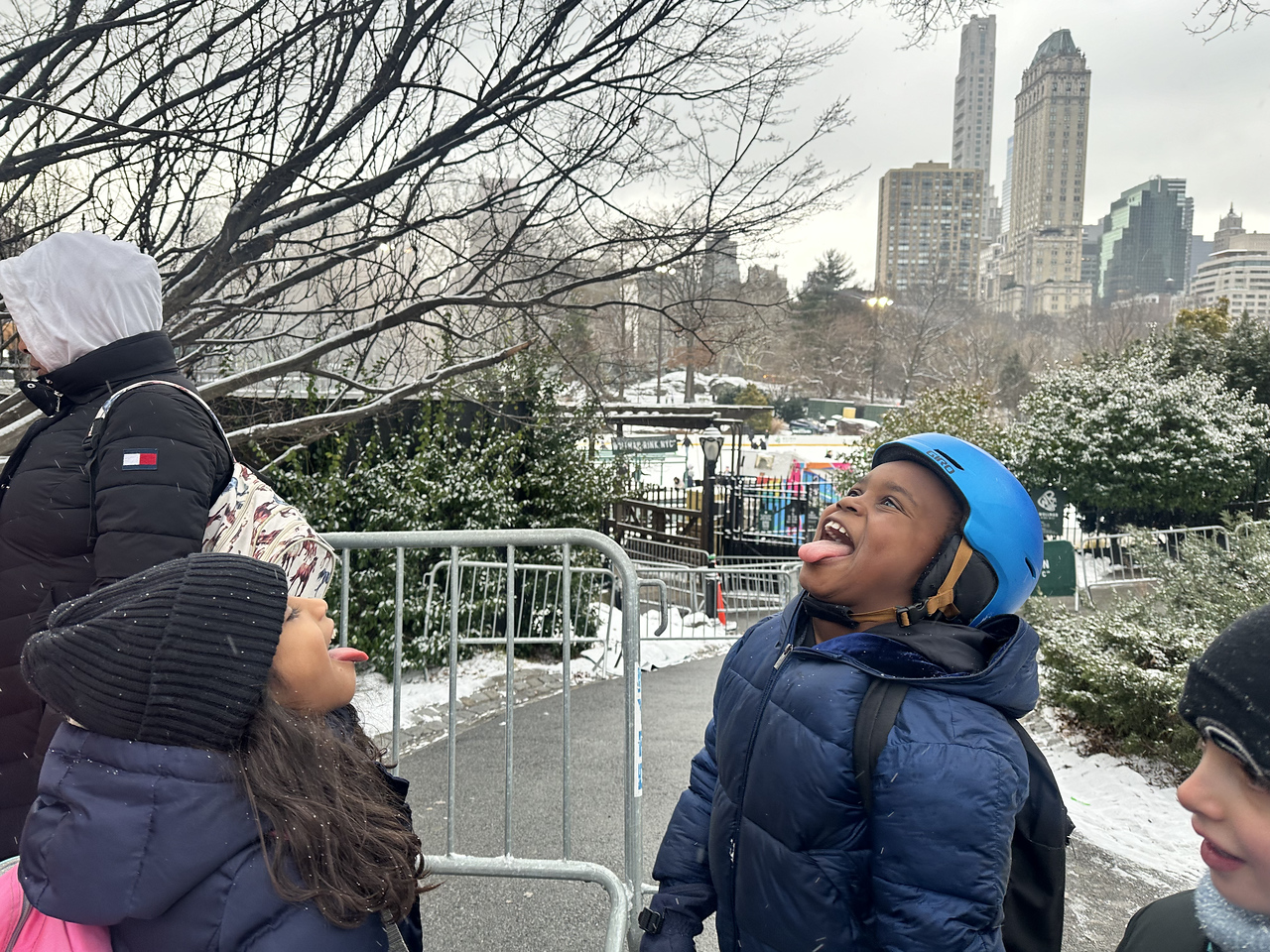 Ethical Culture students enjoy snowfall during after school program.