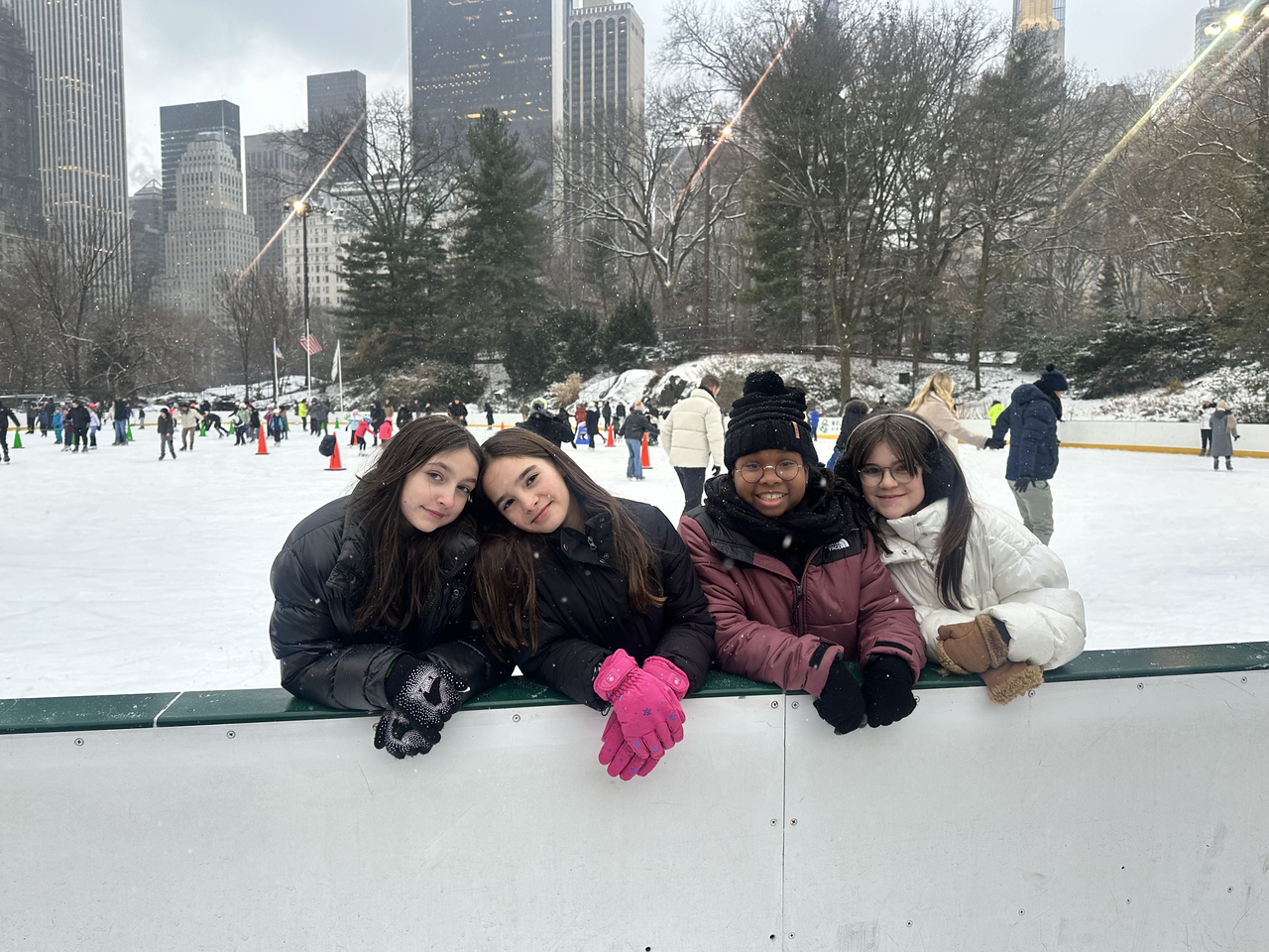 Ethical Culture students pose while ice skating during after school program.