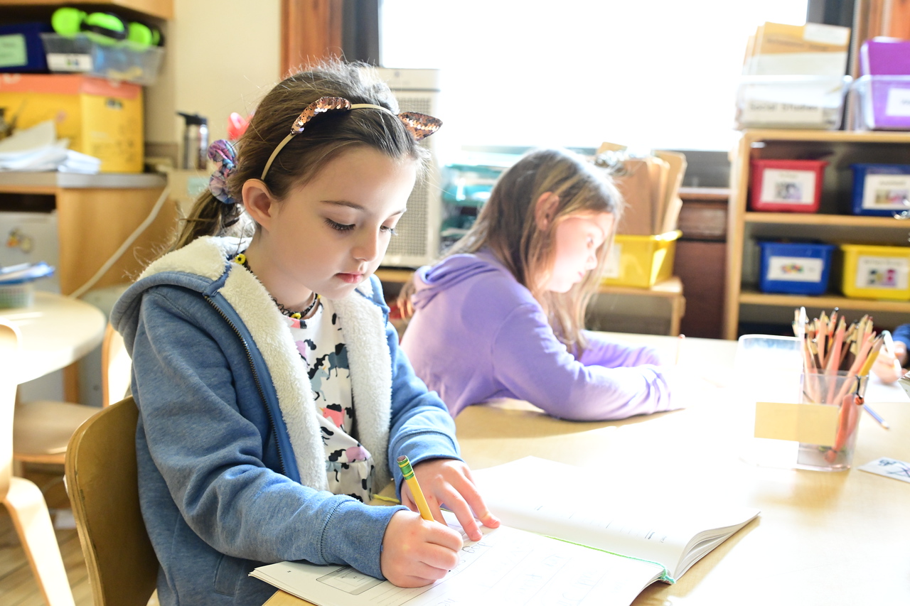 ethical culture fieldston school ethical culture student works on writing exercise at desk