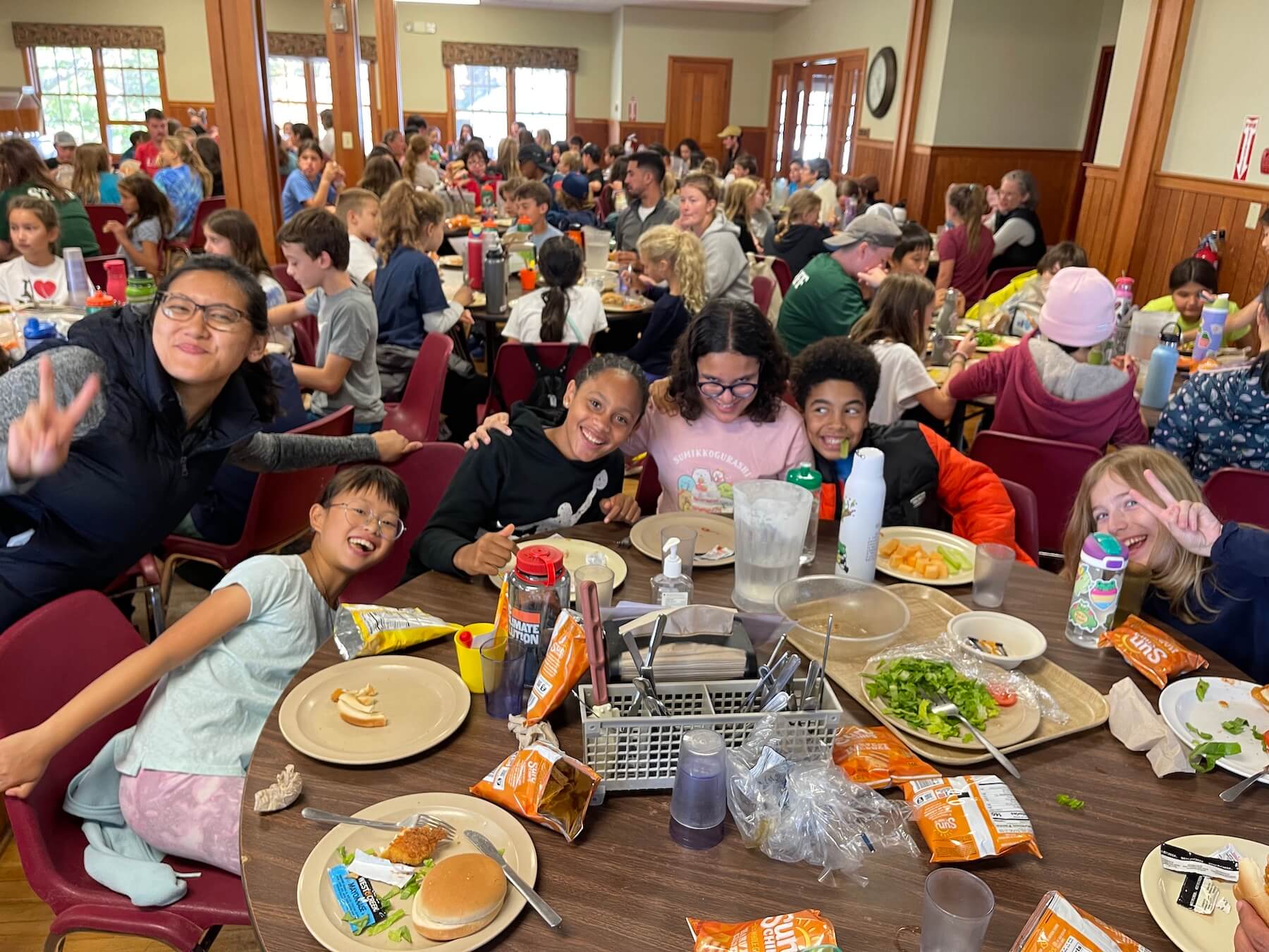 Ethical Culture students smile in lunch room at Nature's Classroom.