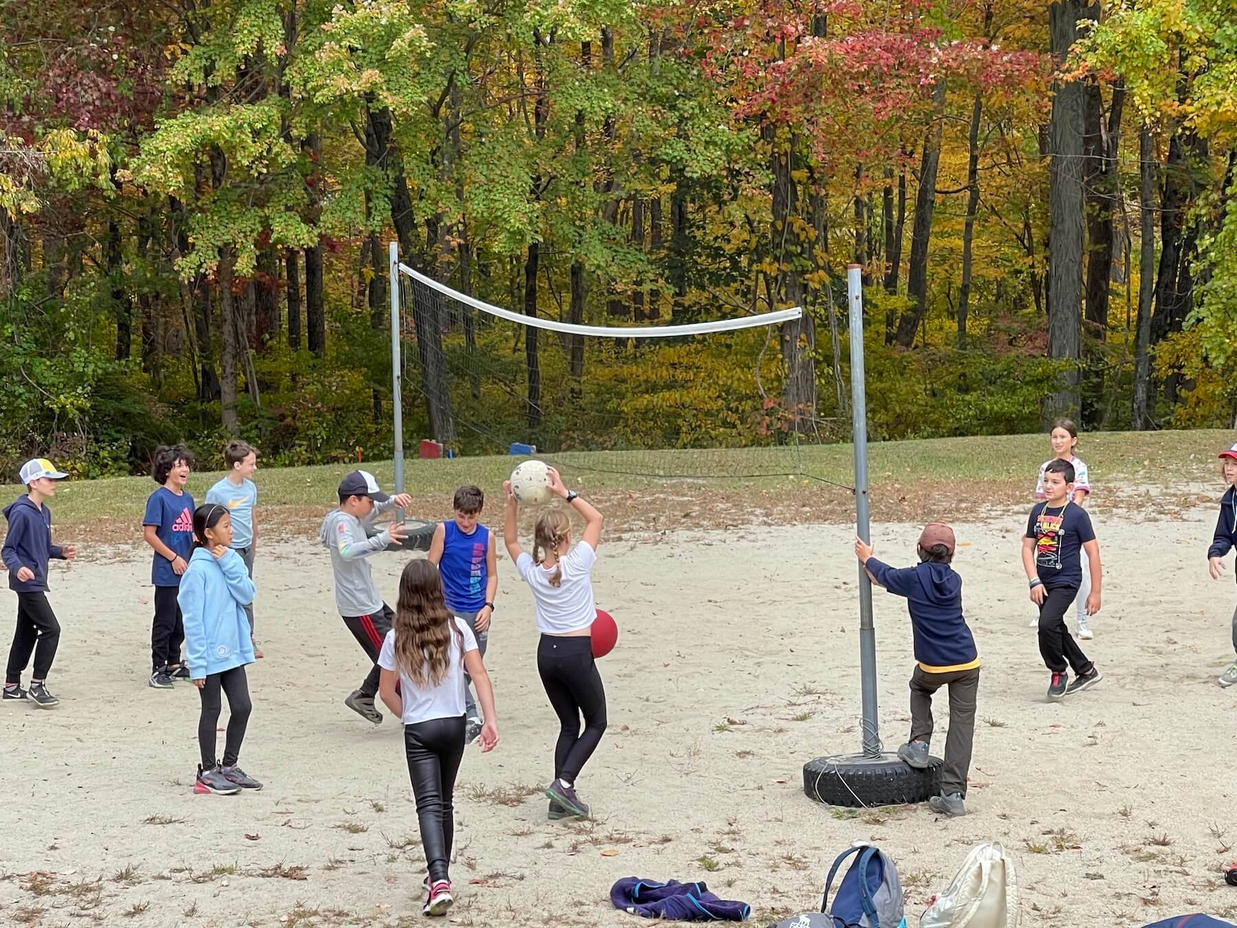 Ethical Culture's 5th Graders play beach volleyball outside.