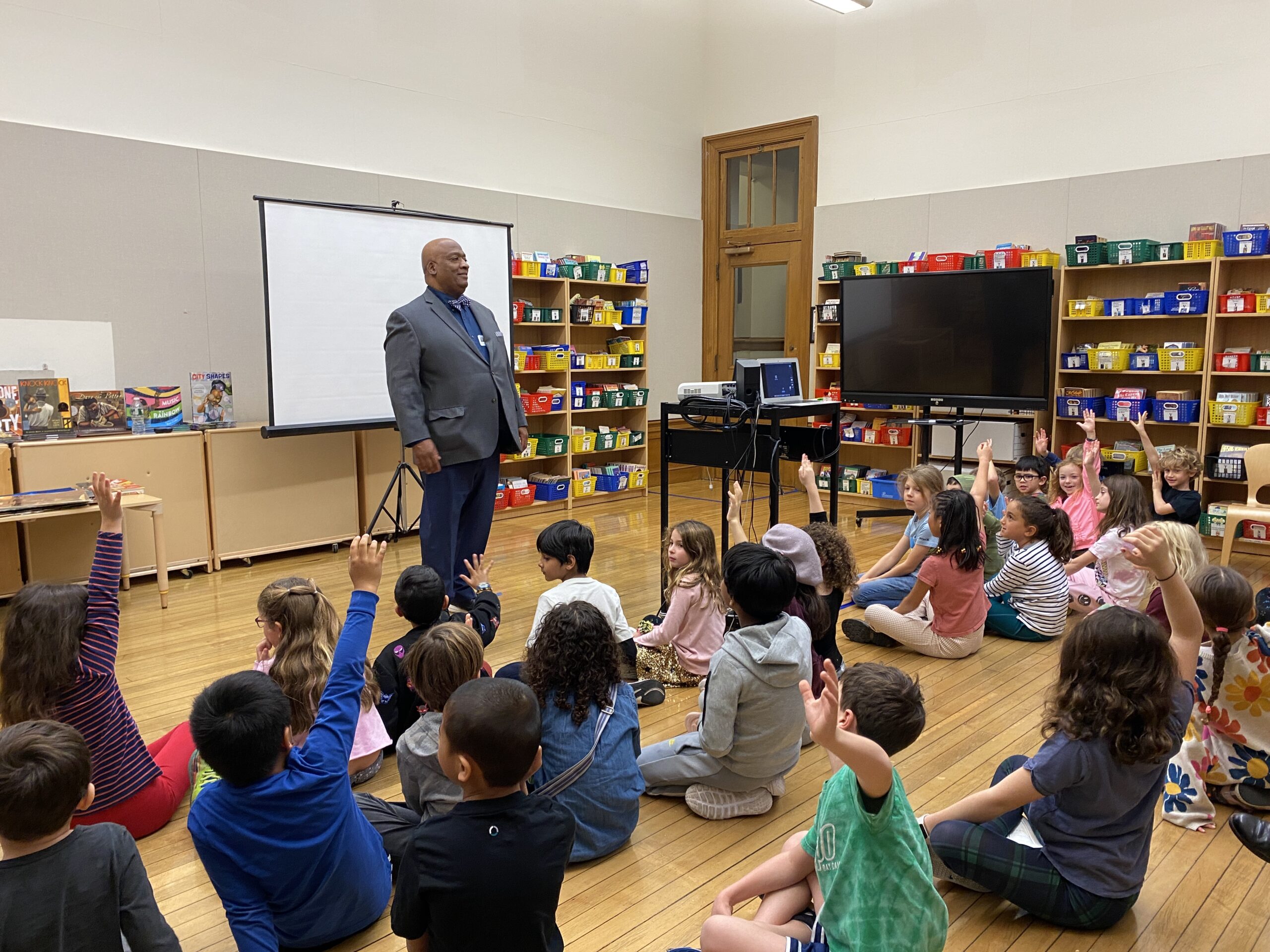 Bryan Collier in front of a class of 2nd Grade students at Ethical Culture
