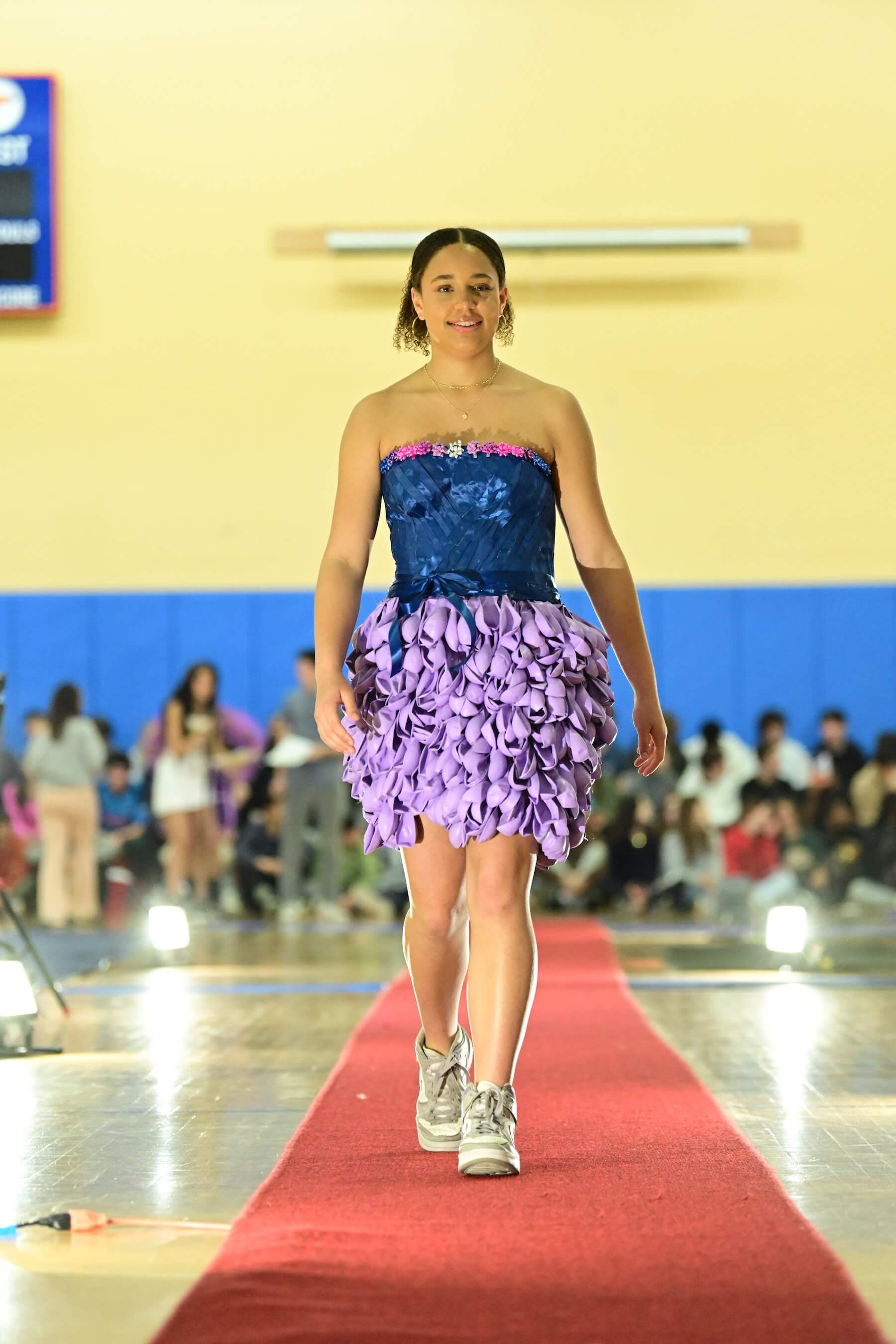 An Ethical Culture Fieldston Upper School student models at the Fashion Show.