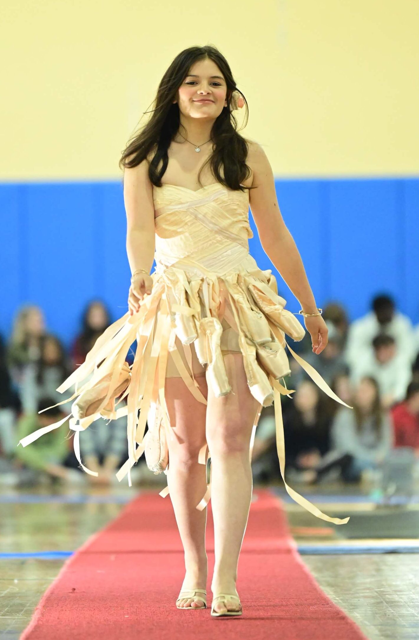 An Ethical Culture Fieldston Upper School student models at the Fashion Show.