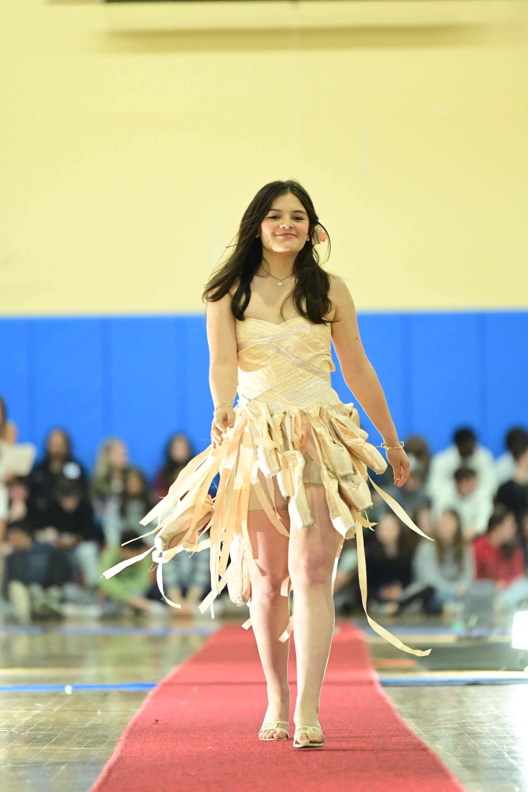 An Ethical Culture Fieldston Upper School student models at the Fashion Show.