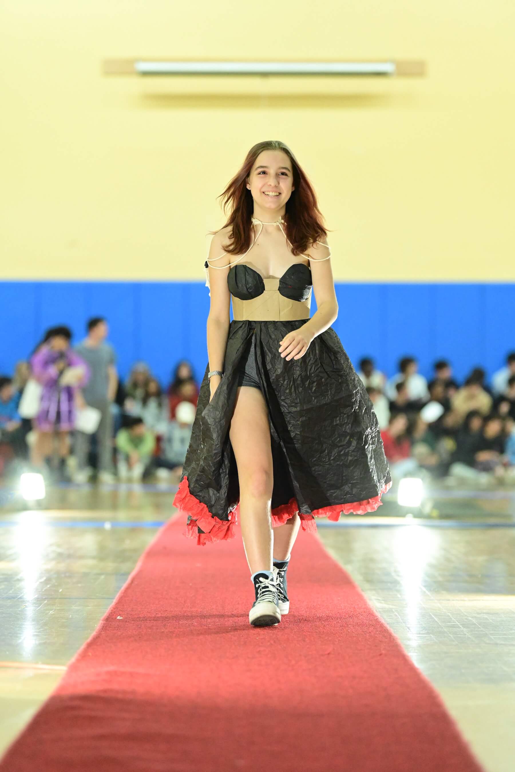 An Ethical Culture Fieldston Upper School student models at the Fashion Show.