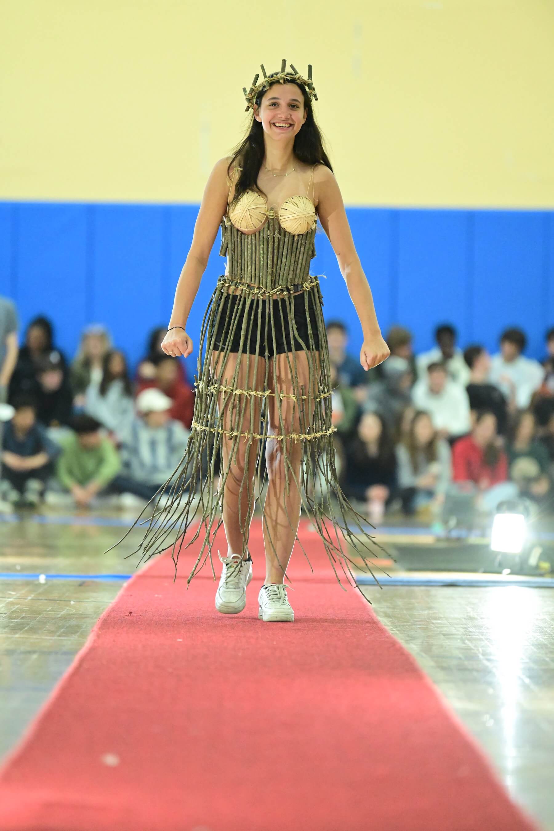 An Ethical Culture Fieldston Upper School student models at the Fashion Show.