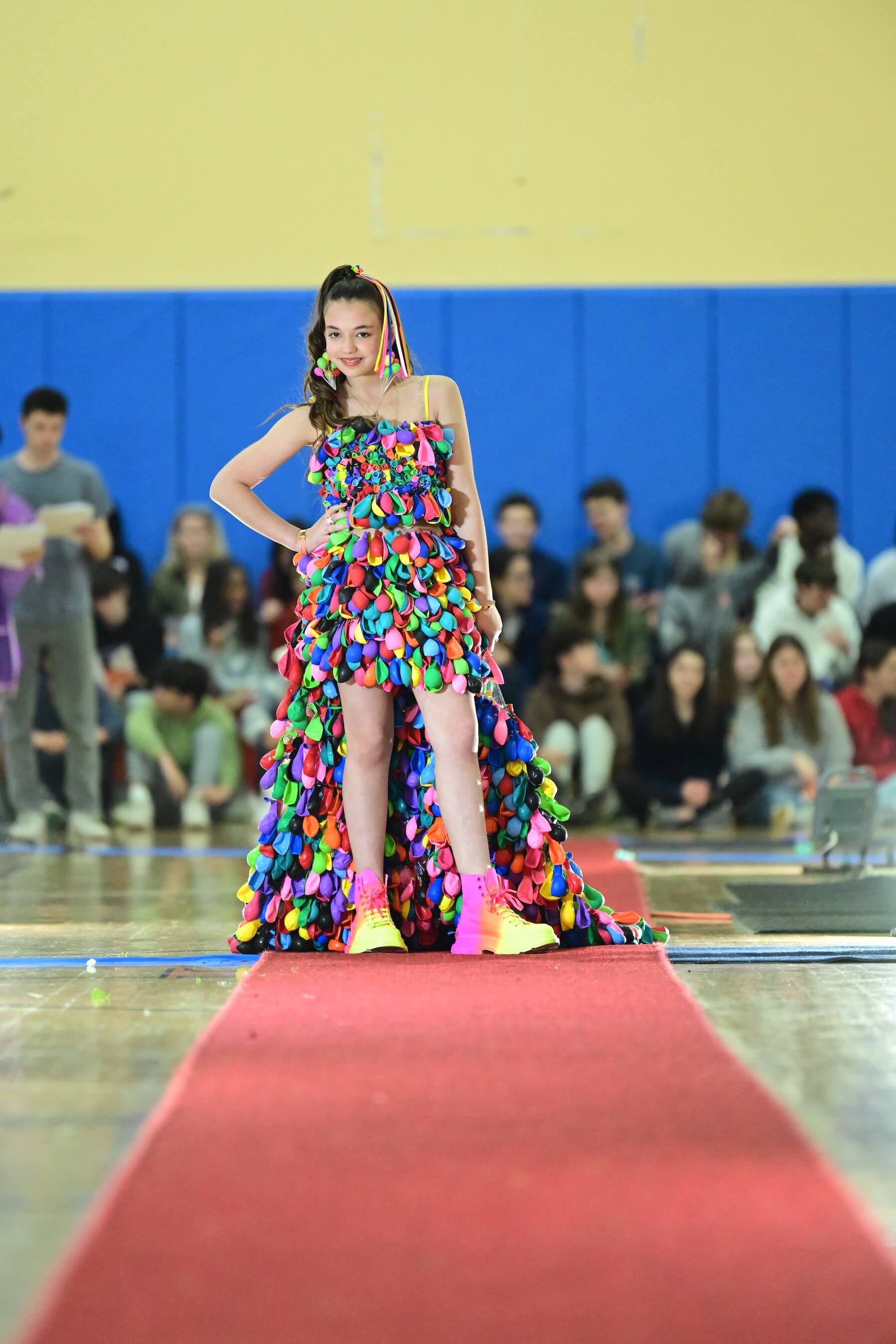 An Ethical Culture Fieldston Middle School student models at the Fashion Show.