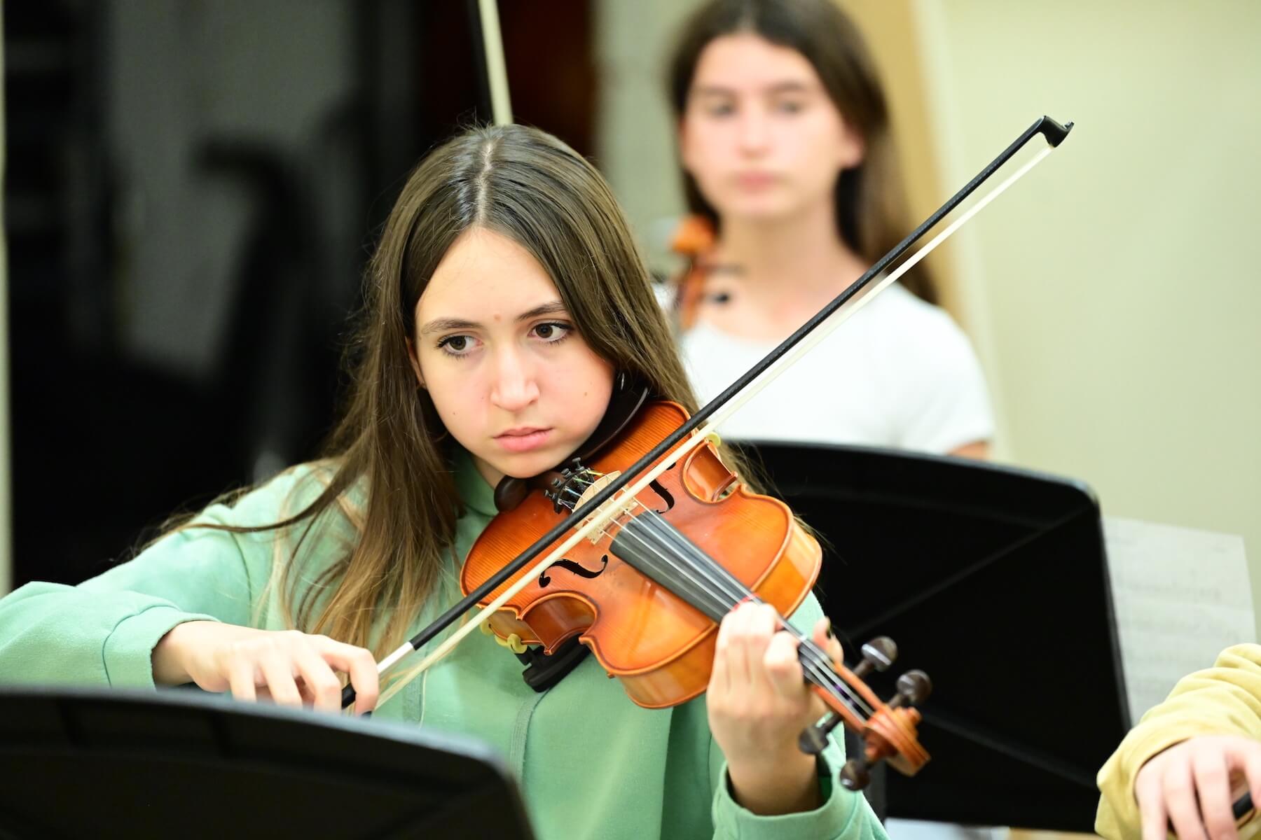 Ethical Culture Fieldston School Fieldston student practicing violin